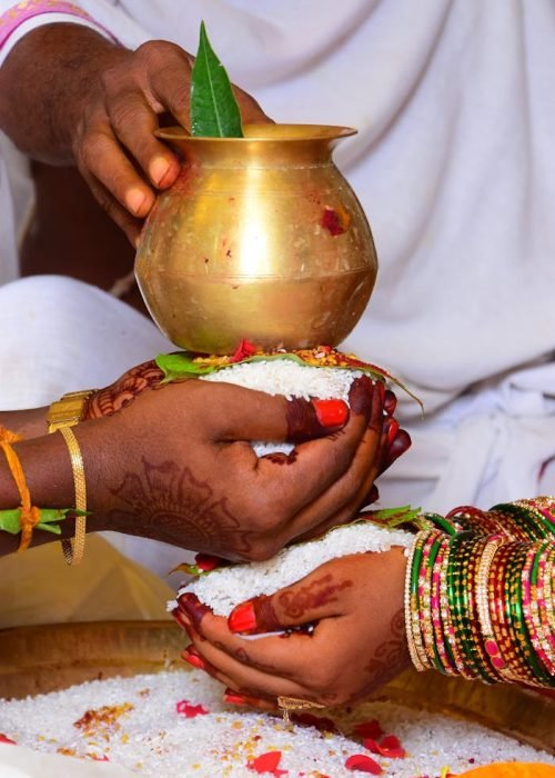 A Bride and Groom Doing the Talambralu Ritual